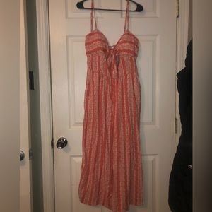 A.W.W. Coral Romper with lace strip decals.